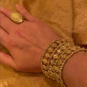 Cuff golden bracelet with large golden pearl ring